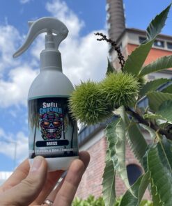 Smell Crusher Absorber Spray Breeze odor eliminator held outdoors